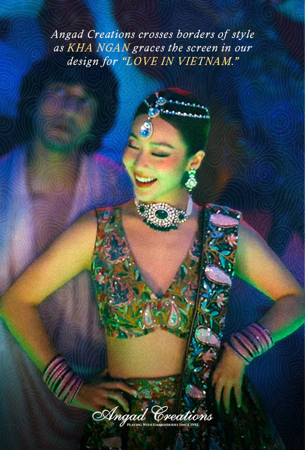 Woman in traditional attire with colorful jewelry against a blue background, featuring text about Angad Creations.