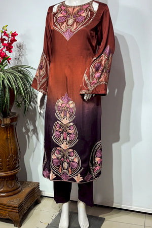 #OmbreWine&Purple Brown embroidered dress on a mannequin against a white wall with a plant to the left.
