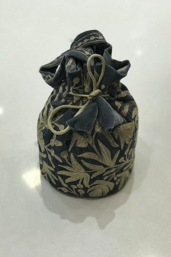 #Gray Fabric drawstring bag with floral pattern on a white background