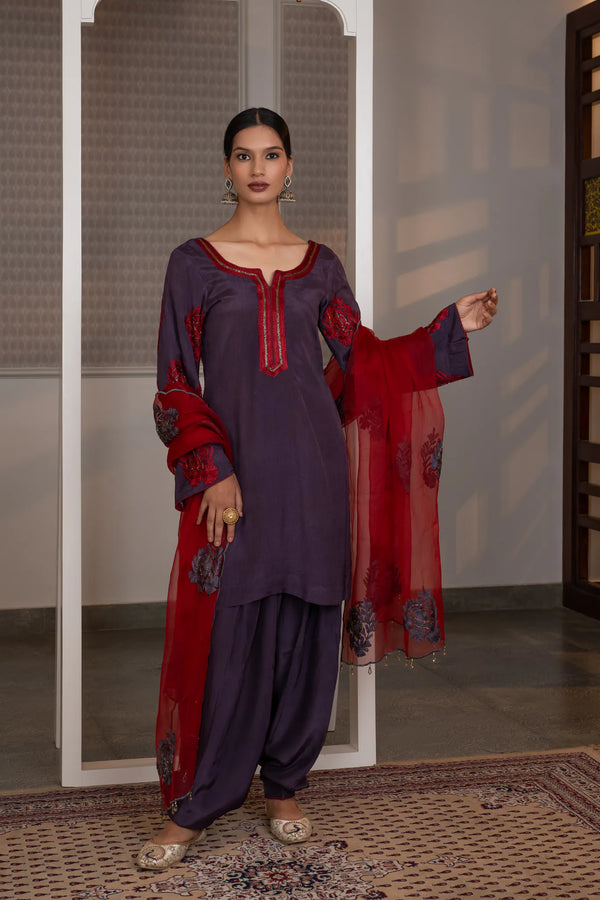 #Mauve - Full-length front view of mauve kurta salwar set with crimson dupatta draped on arm; scalloped dupatta edge and tassel drops visible