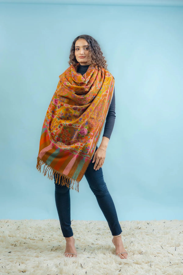 Detail of tight Kani weave on mustard Pashmina showing colour transitions in the floral pattern