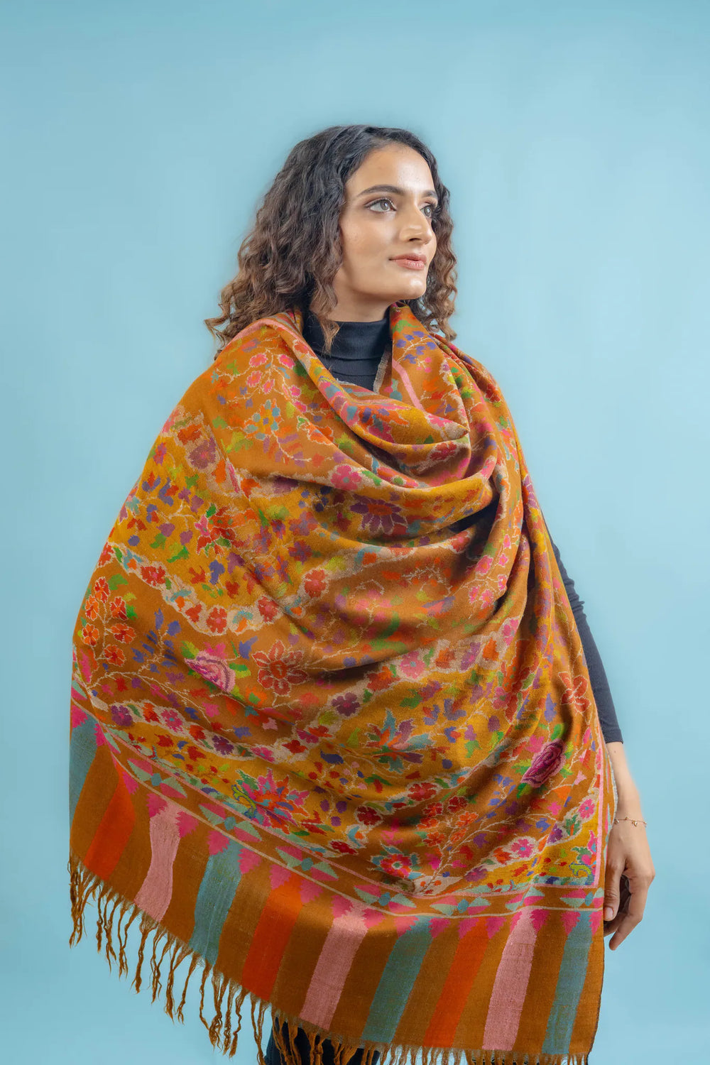 Mustard Kani Pashmina shawl draped over shoulders, showing full width and length