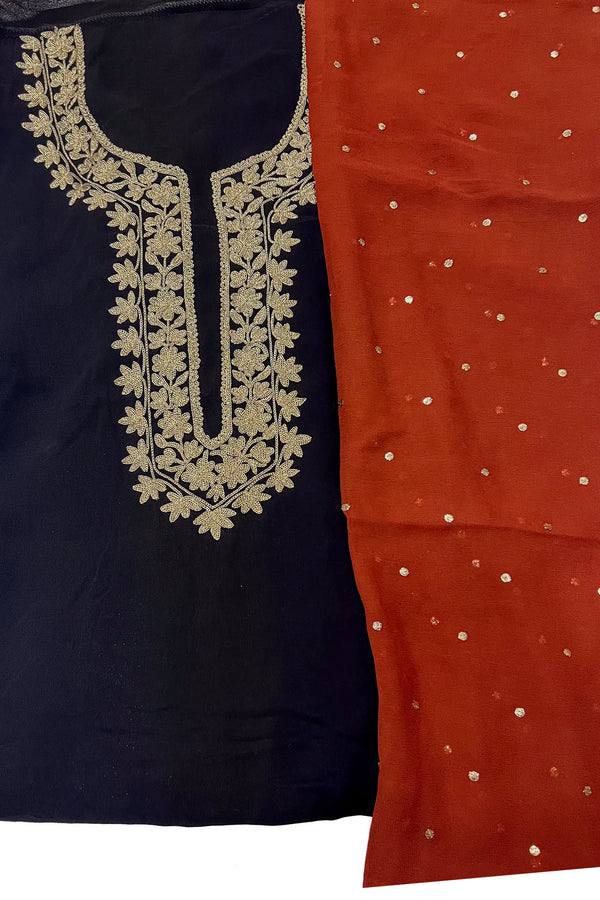 #Black - Flat lay detail of gold tilla neckline embroidery on black base alongside rust dupatta with scattered gold embroidery