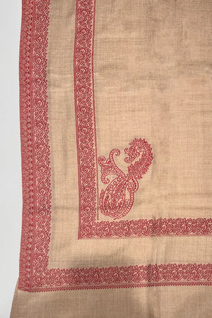 # Natural - Natural wool shawl corner detail showing red machine woven double border with paisley boteh and floral band