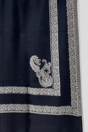 #Black - Black wool shawl detail showing Ivory machine-woven double border with floral band and corner paisley motif in close-up
