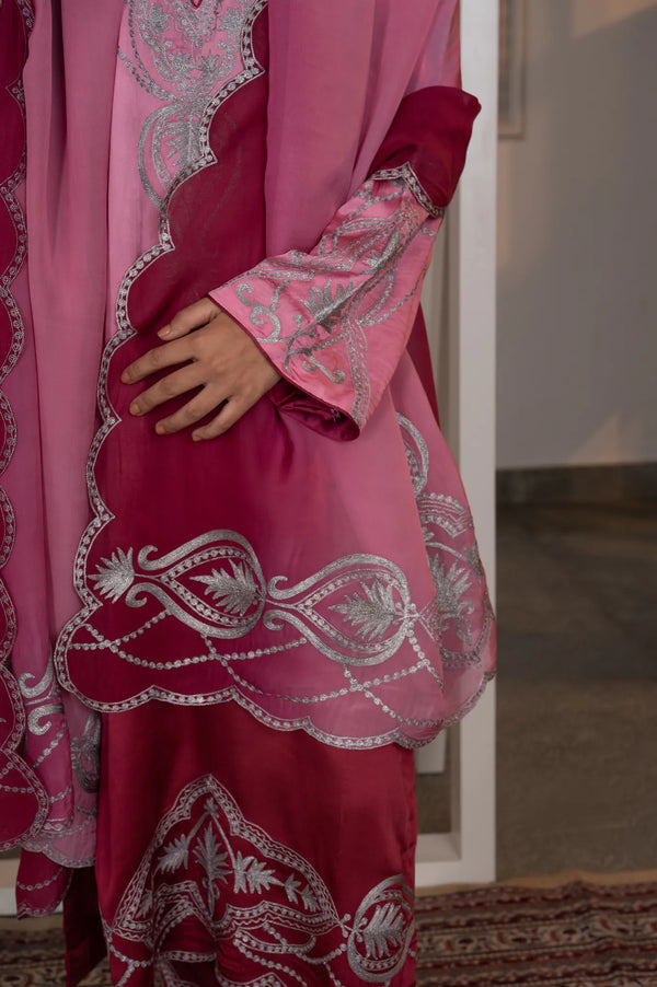 #OmbreRosePink&DeepBerry - Detail of scalloped kurta hem and dupatta border showing silver zari paisley and floral swag embroidery on deep wine ground