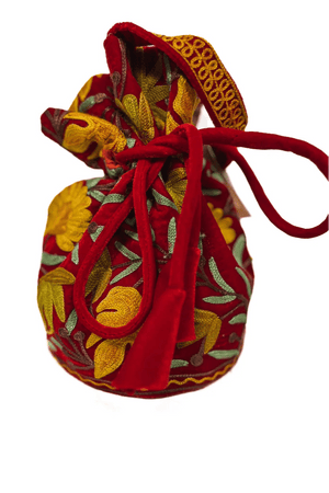 Decorative fabric pouch with red drawstring on a white background