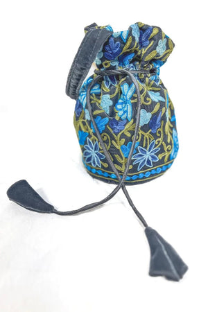 Decorative drawstring bag with blue floral patterns on a white background