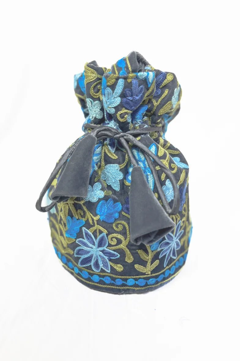 Decorative drawstring bag with floral pattern on a white background