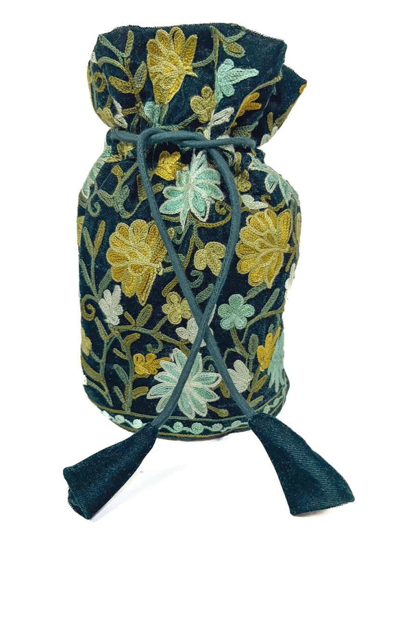 Decorative fabric bag with floral embroidery on a white background