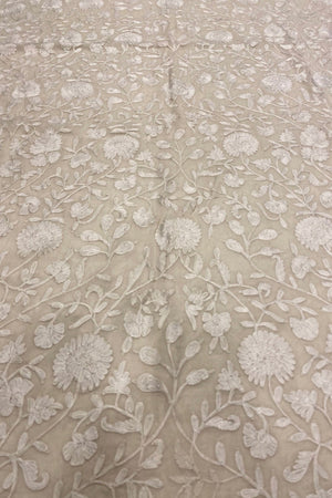 Textured fabric with floral pattern on a off-white background