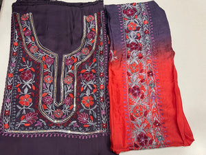#mauve Two pieces of fabric, one with a floral Aari and sequence work in the center and the other with a border featuring the same style of work.