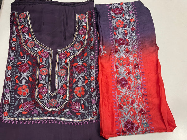 #mauve Two pieces of fabric, one with a floral Aari and sequence work in the center and the other with a border featuring the same style of work.