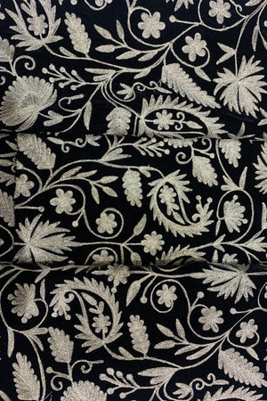 #black Black fabric with intricate dull gold floral embroidery