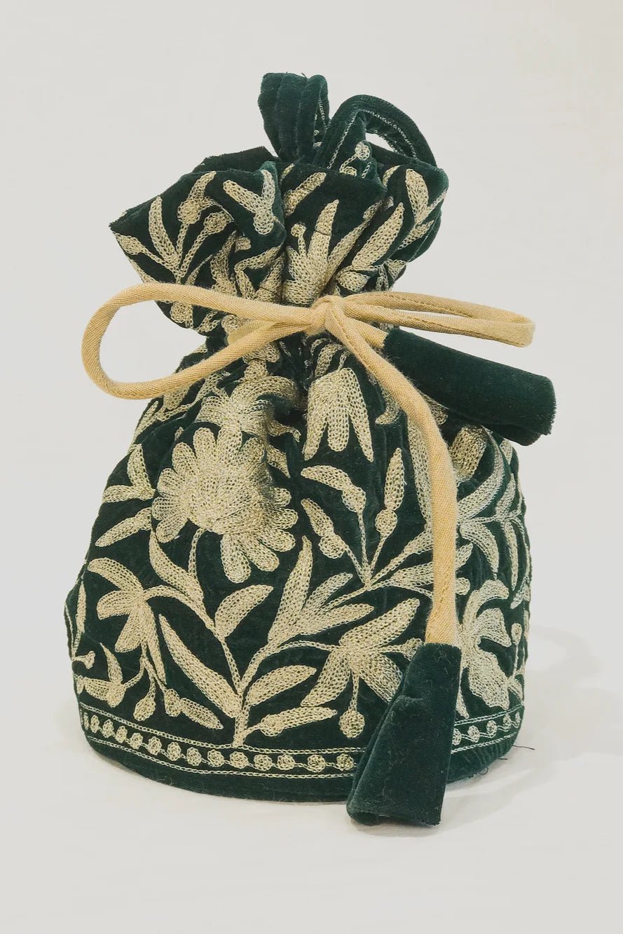 #BottleGreen Green fabric drawstring bag with gold floral patterns on a white background