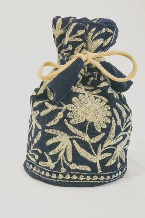 #NavyBlue Navy blue drawstring bag with beige floral patterns on a white background
