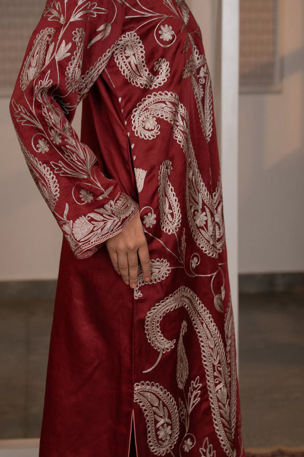 #CrimsonMaroon - Close-up side view of wine linen satin kurta showing large paisley kalka motifs and floral vine embroidery in dull gold