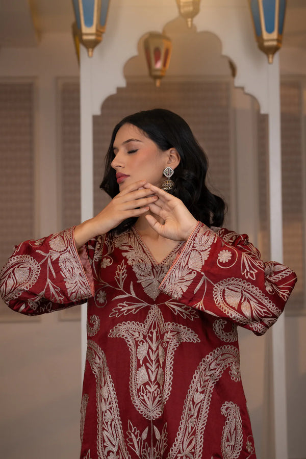 #CrimsonMaroon - Chest and neckline close-up showing v-neck with dull-gold embroidery border and dense floral and paisley work on wine ground