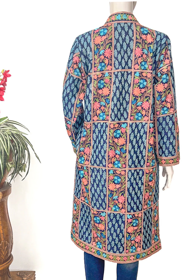 Traditional embroidered kurta on a mannequin against a white background