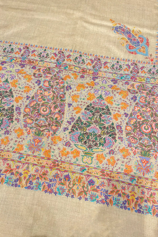 Overhead flat lay of the natural beige Pashmina shawl showing full kalamkari and embroidery layout