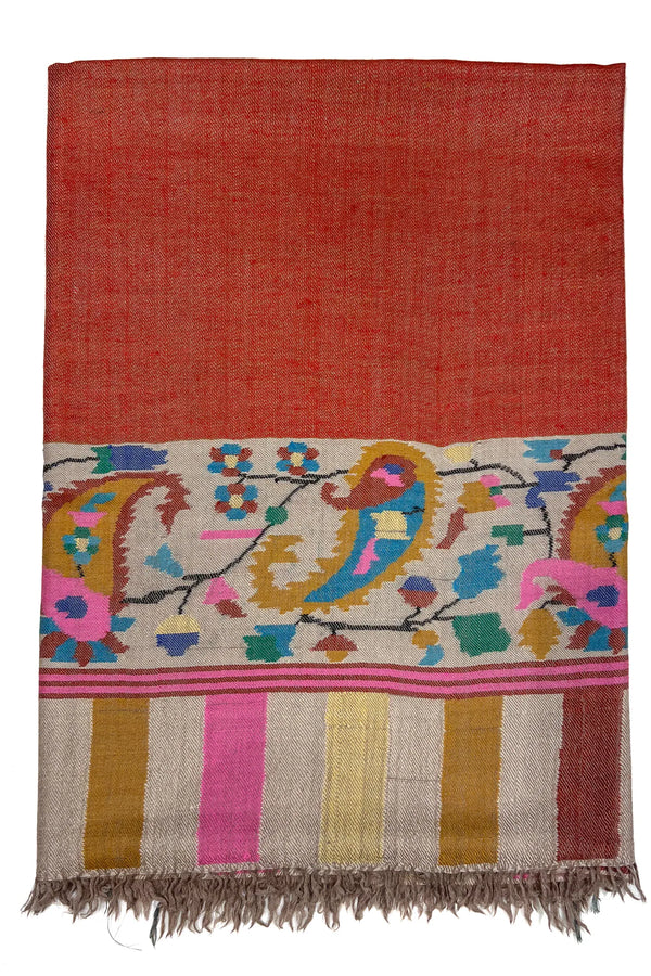 Colorful patterned fabric with birds and floral designs on a red background