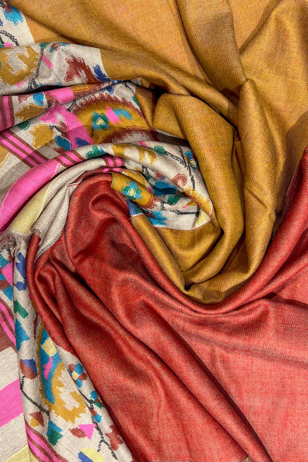 Close-up of colorful fabric with patterns and solid colors.