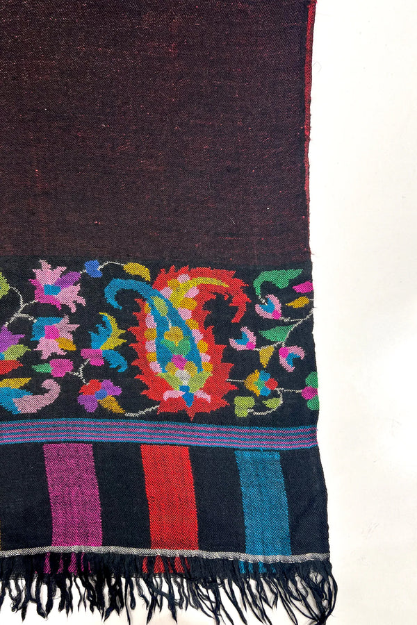 Black scarf with colorful paisley pattern on a white background