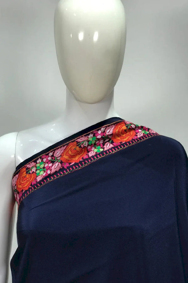 #Navyblue saree with floral border on a mannequin, against a white background.