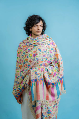 Off-white kani pashmina shawl draped to show full width and depth of the multi-coloured woven design