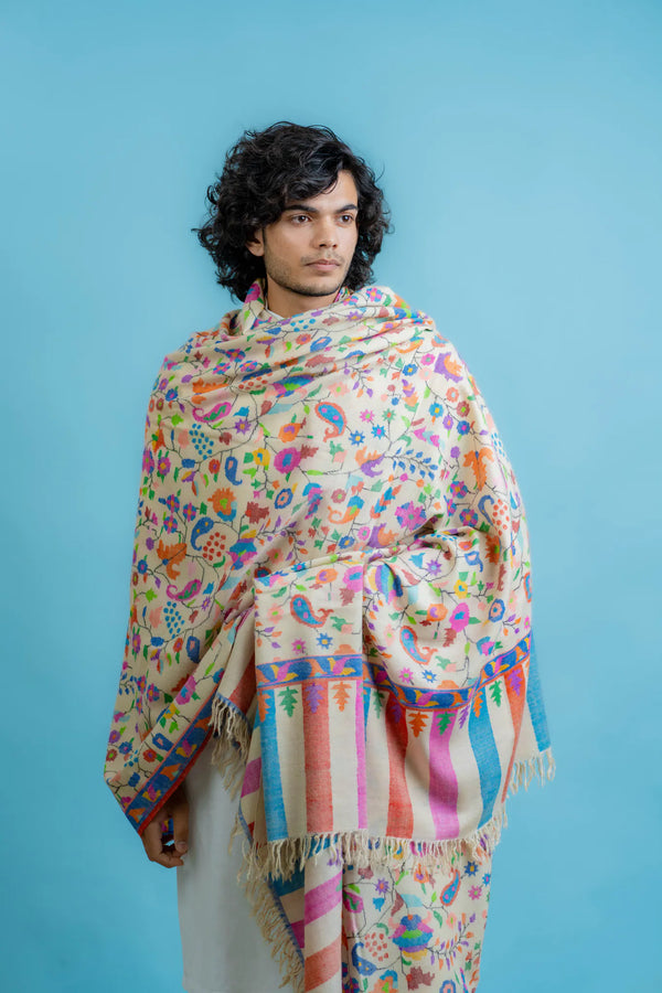 Off-white kani pashmina shawl draped to show full width and depth of the multi-coloured woven design