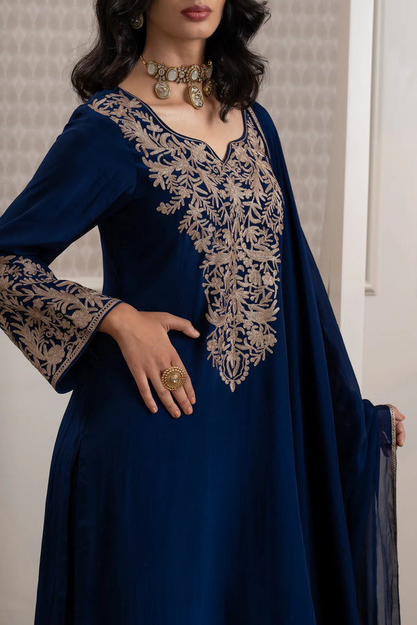 #NavyBlue - Close-up of neckline and chest showing dense dull-gold zari floral vine and medallion embroidery on navy Indian crepe.