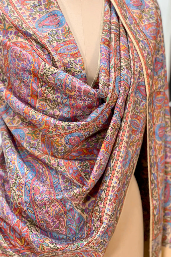 Beige pashmina shawl draped over the shoulders, showing embroidery placement and drape