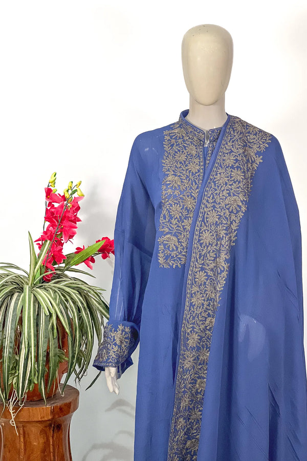 #Blue - Chinon suit set on mannequin showing diagonal dupatta drape with gold floral border and placement yoke work