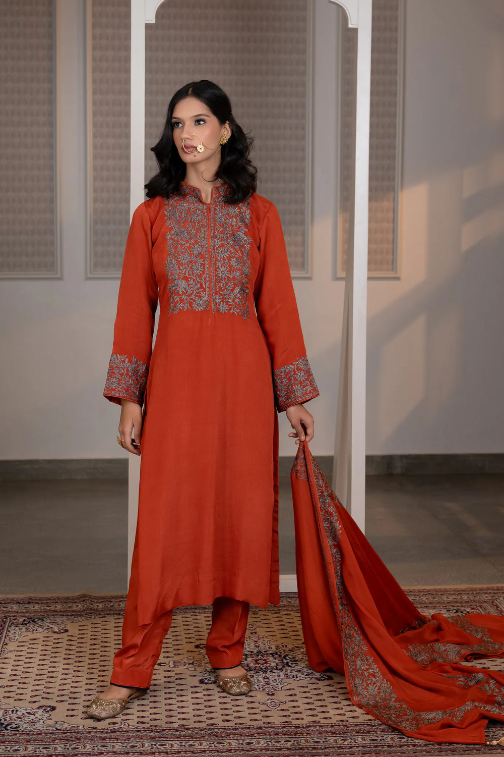 #Rust - Front view of rust Chinon kurta with dense floral embroidery on chest yoke and centre placket; straight silhouette with salwar