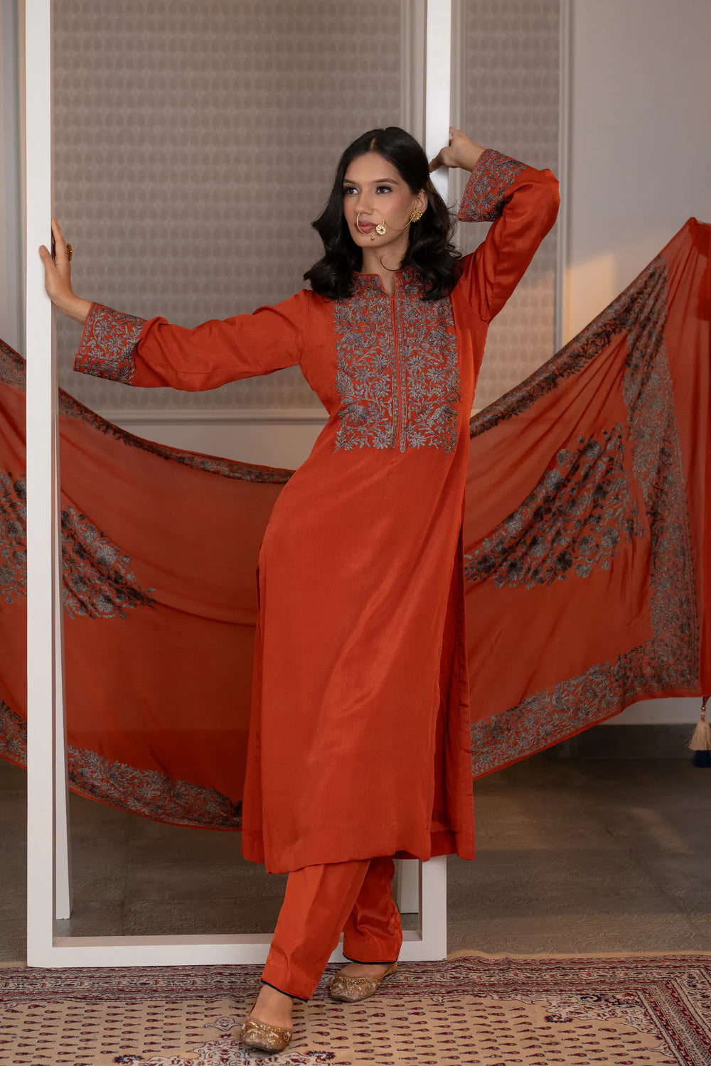 #Rust - Front view of rust Chinon kurta with dense floral embroidery on chest yoke and centre placket; straight silhouette with salwar
