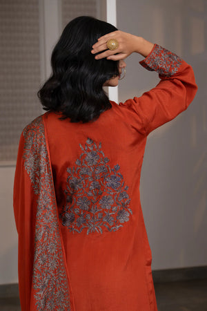 #Rust - Back close-up showing large floral medallion embroidered in dull gold and navy on rust Chinon kurta back