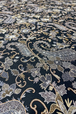 Shawl placed on surface to show the full jaal coverage and tight weave structure of the black pashmina
