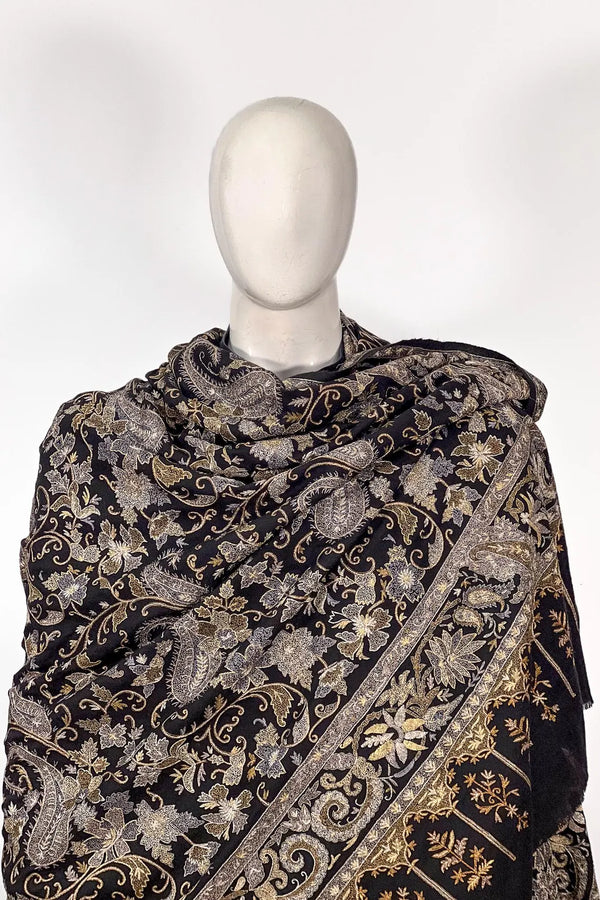 Styled drape of black tilla jaal pashmina shawl over shoulder, showing fall and surface coverage
