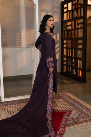 #Mauve - Side profile showing full length of plum Chinon kurta with side slit, embroidered dupatta trailing, and embroidered cuff visible.