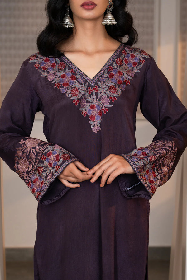 #Mauve - Close-up of v-neckline embroidery on plum Chinon kurta with flared embroidered cuffs, showing multicolour floral and leaf zari motifs.