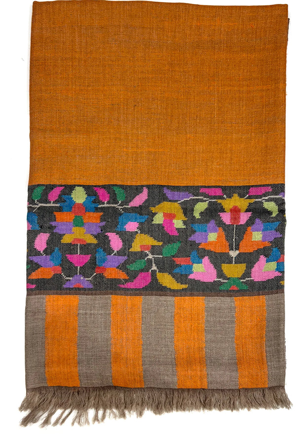 Textile with a colorful pattern on a black border