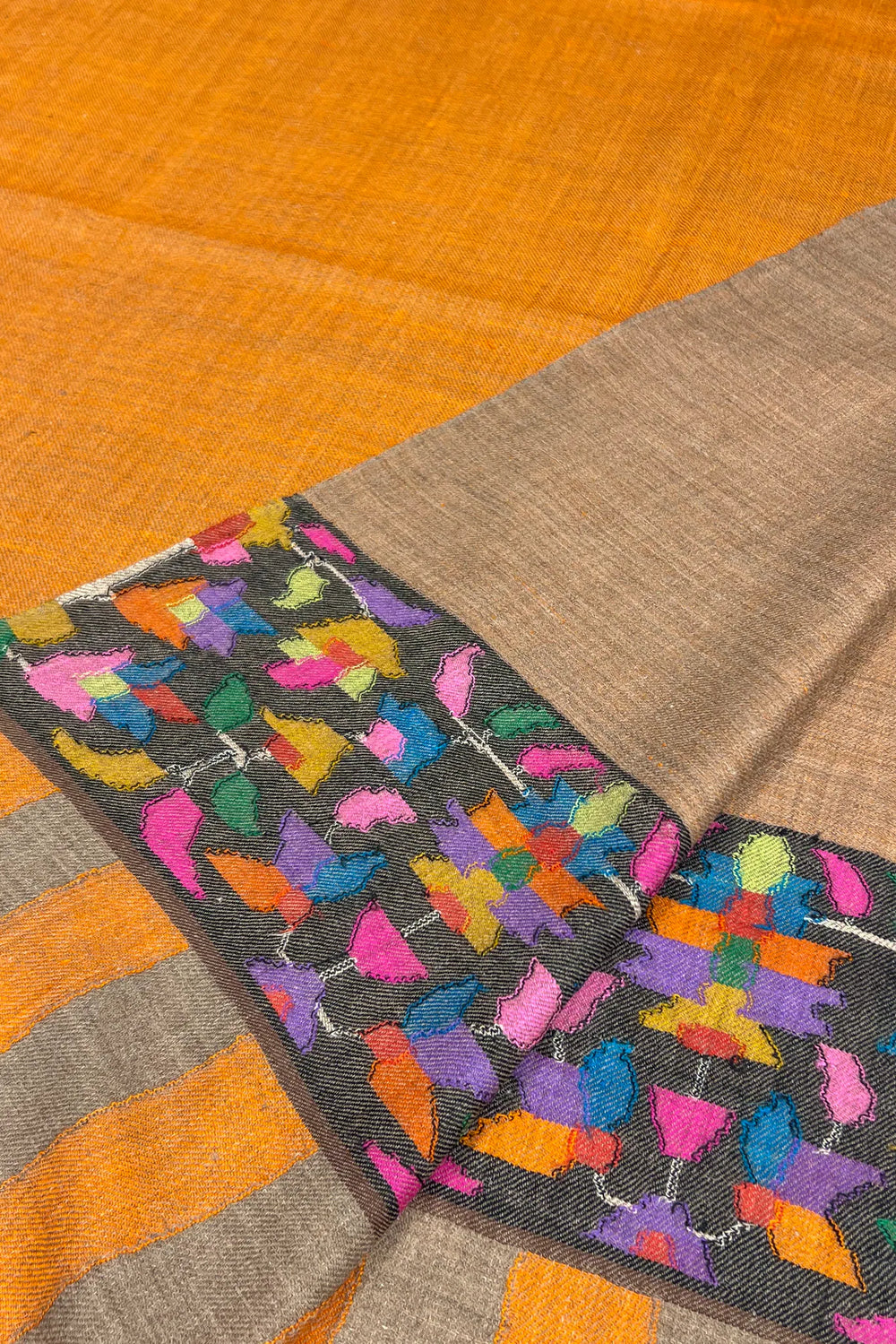 Close-up of multicolored fabric with a pattern of flowers