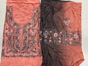 #Peach Two pieces of fabric, one with a floral Aari and sequence work in the center and the other with a border featuring the same style of work.