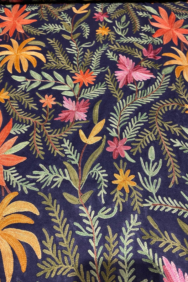 Floral and leaf pattern on a dark blue background