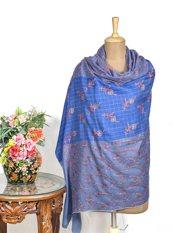 Dual blue pashmina shawl folded to show the tight weave and embroidered jaal surface