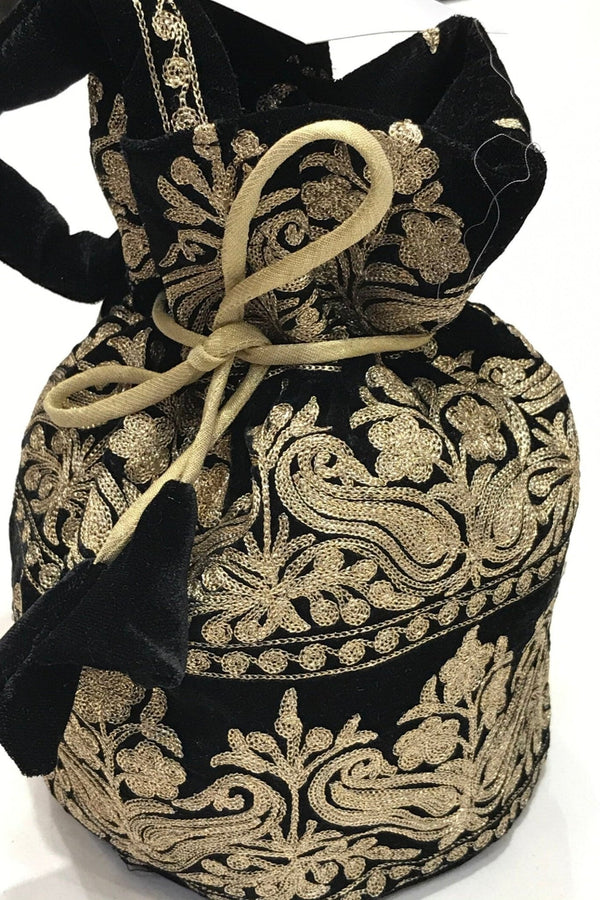 #black Black drawstring bag with gold embroidery on a white background