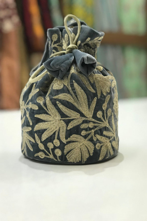 #Gray Decorative fabric pouch with floral pattern on a white surface