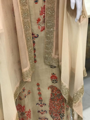 Traditional embroidered garment with intricate patterns and embellishments.