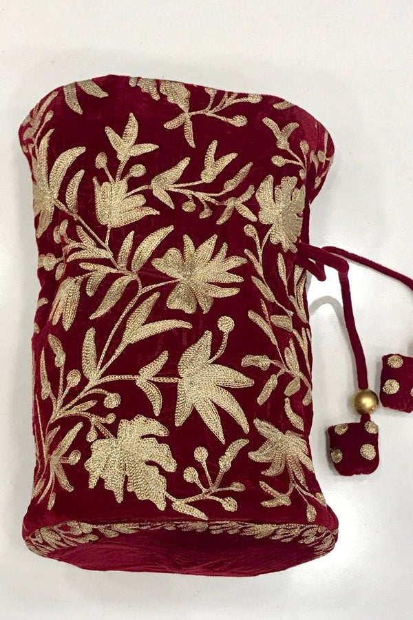 #Red Maroon jewelry pouch with gold floral patterns on a white background