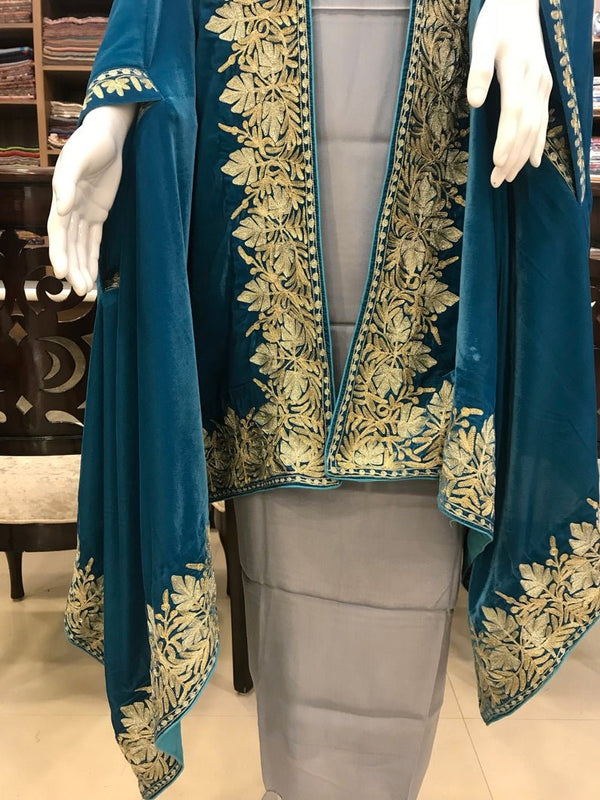 #Turquoise Teal outfit with gold embroidery on a mannequin in a store setting